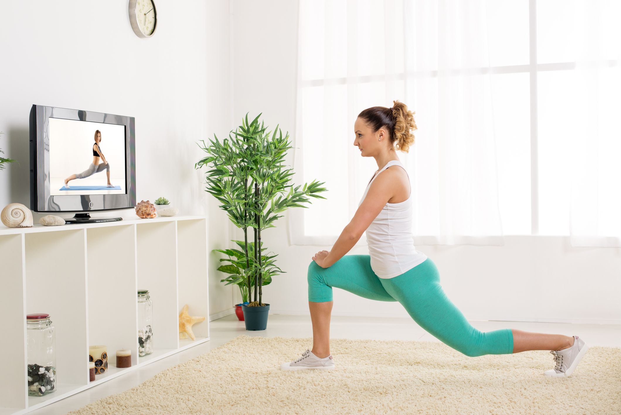 Young Woman Doing Stretching Exercises